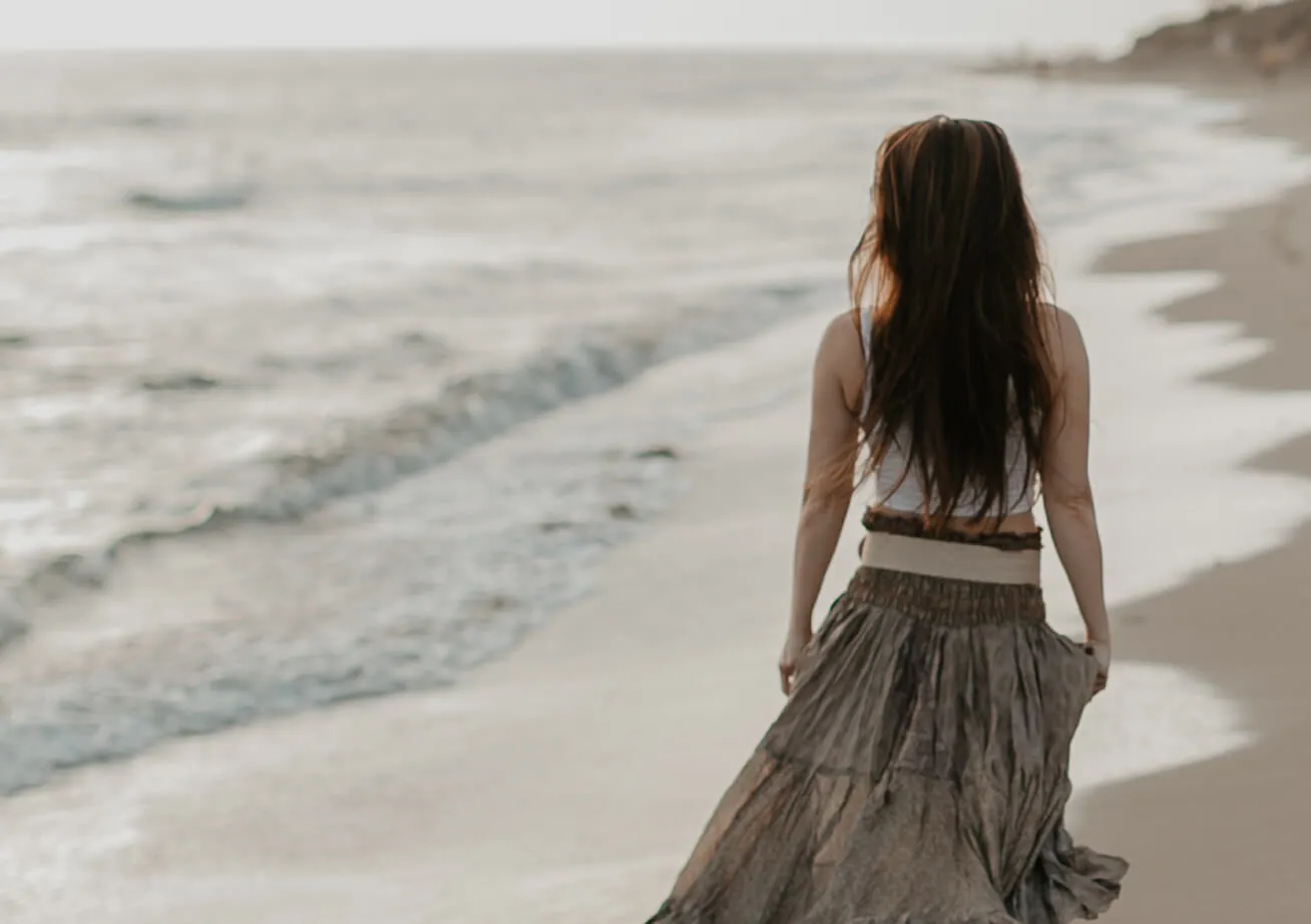 woman walking on beach