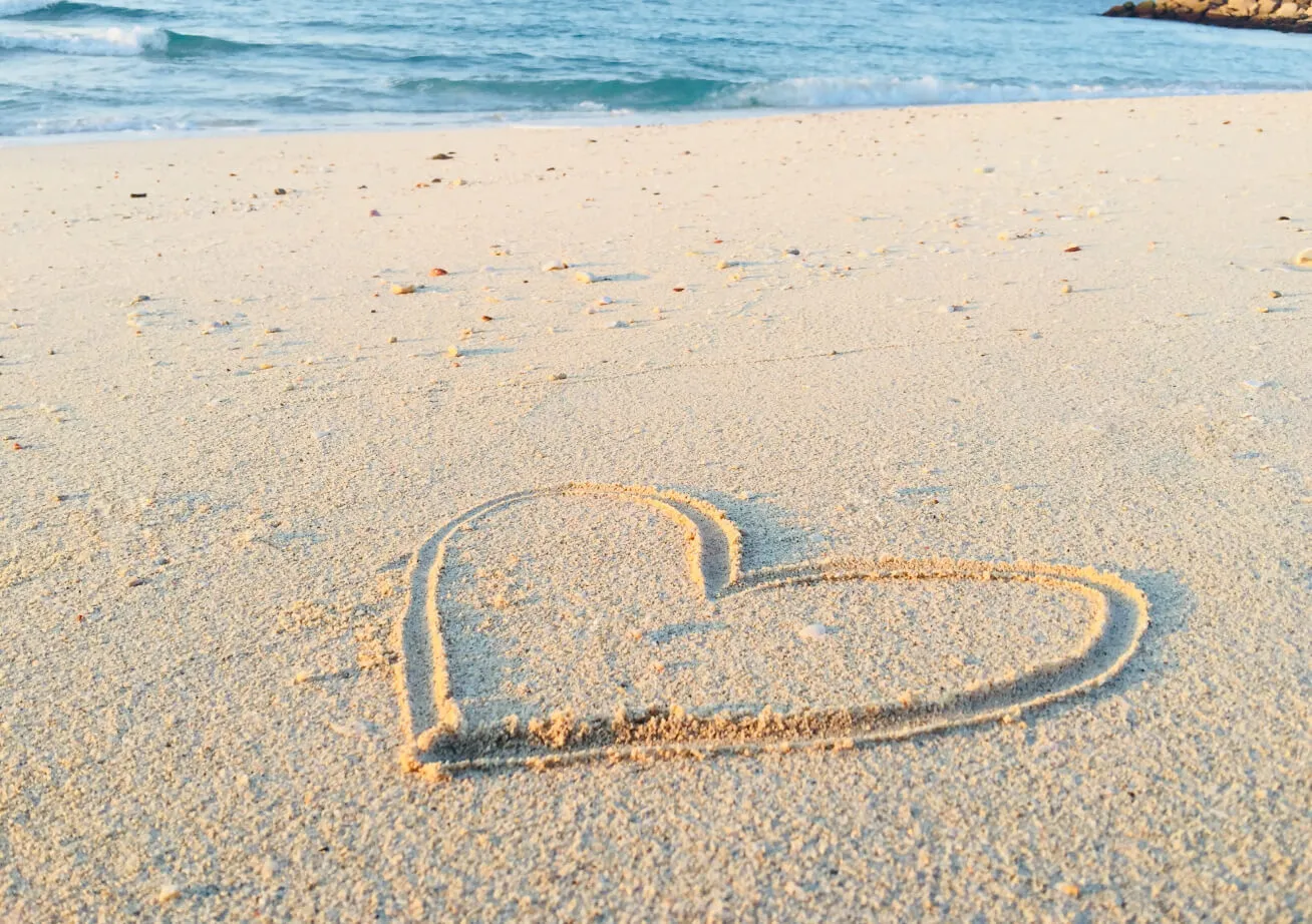 heart drawn on sand