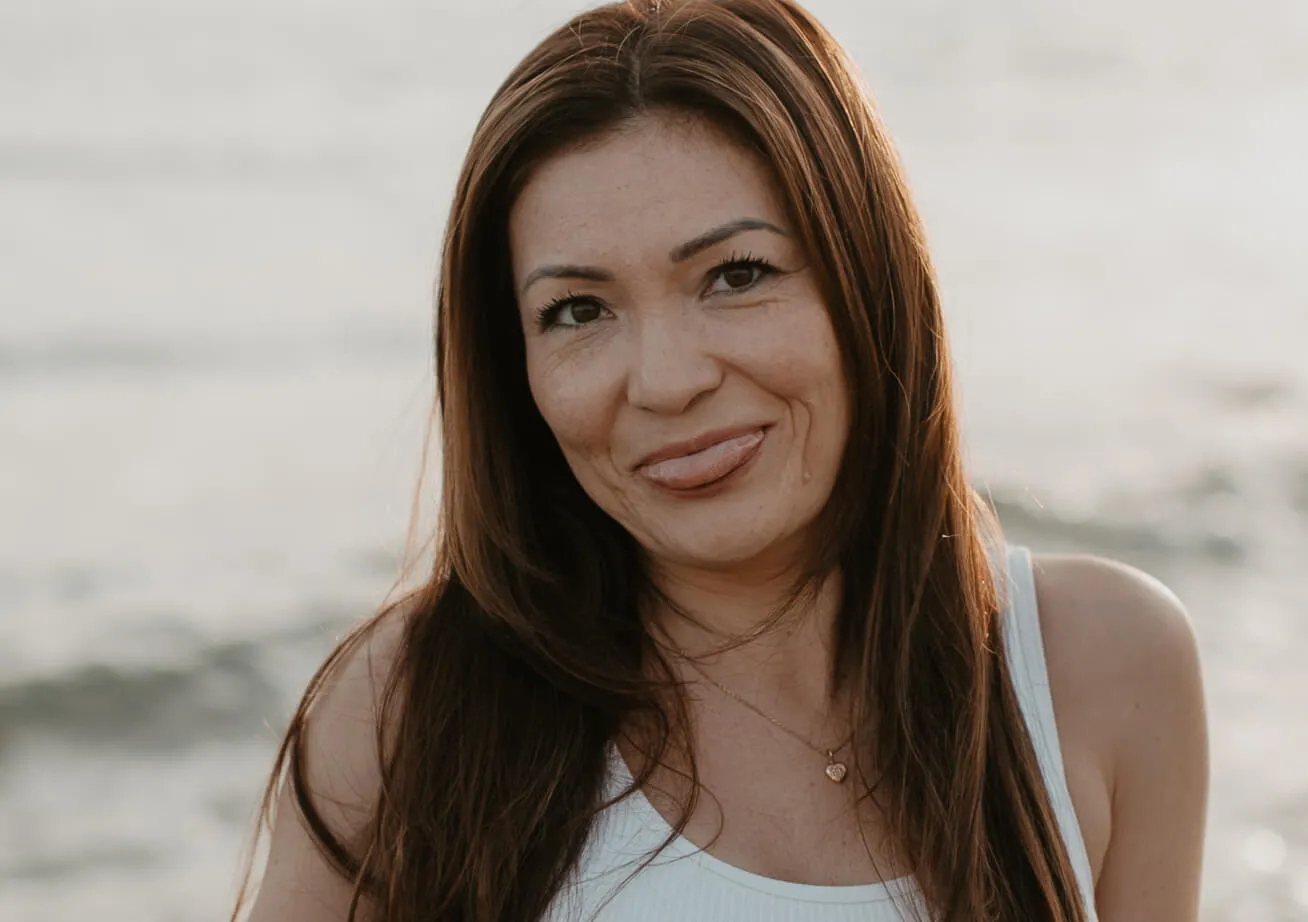 woman smiling at the beach